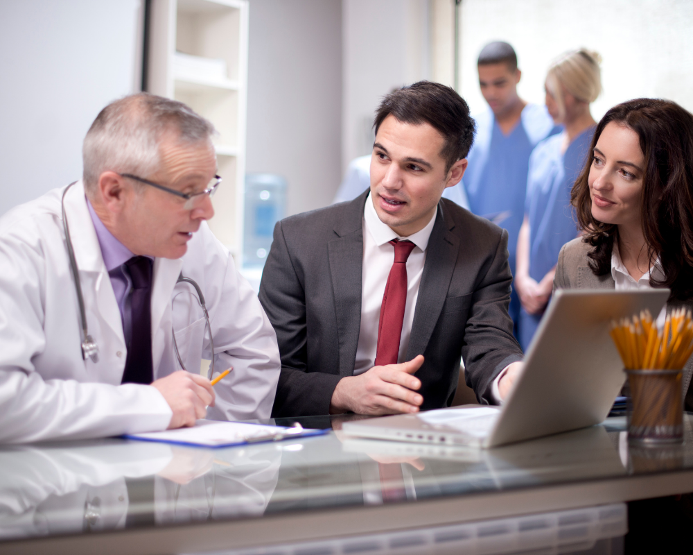 A doctor meeting some medical sales team