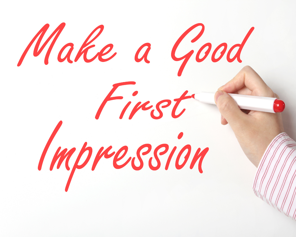 Make a good impression written in red pen on a whiteboard 