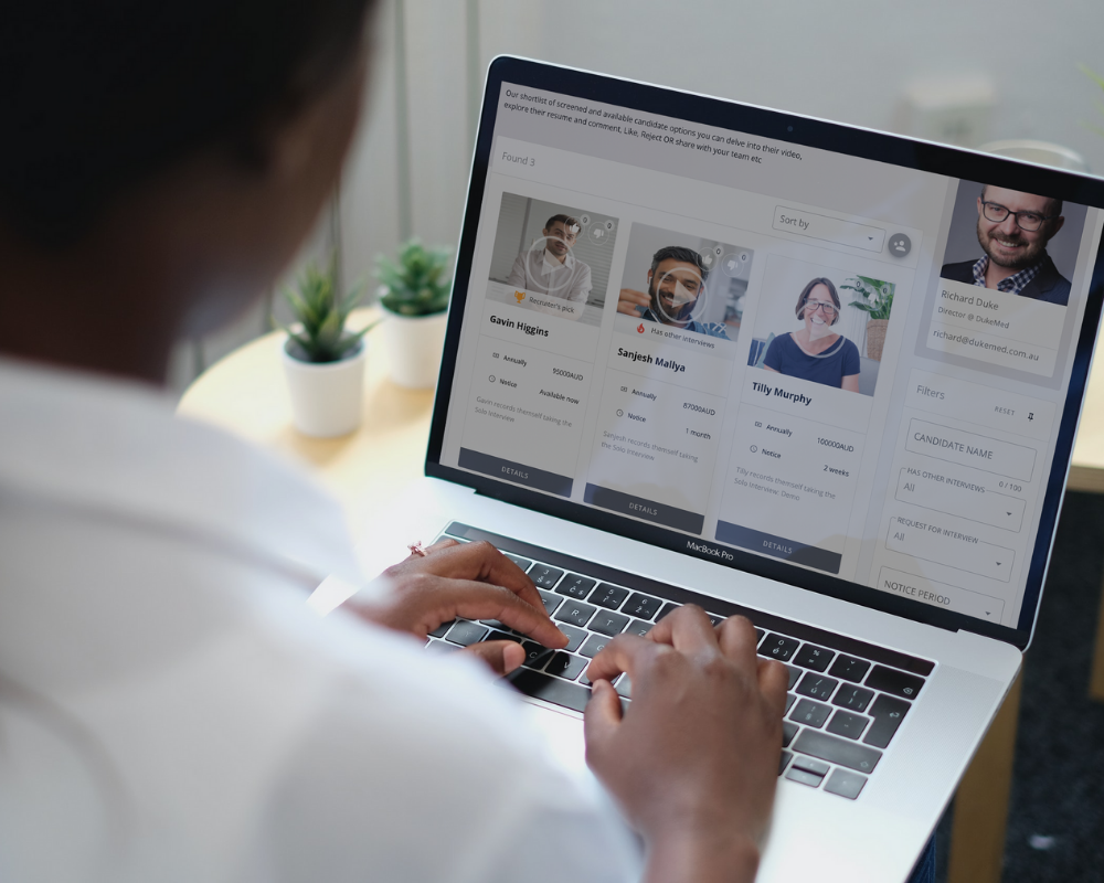 Woman on a laptop looking at a talent dashboard.