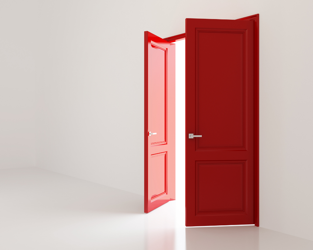 Red doors opening with light shining through—symbolizing new career opportunities for allied health professionals moving into MedTech sales and corporate roles