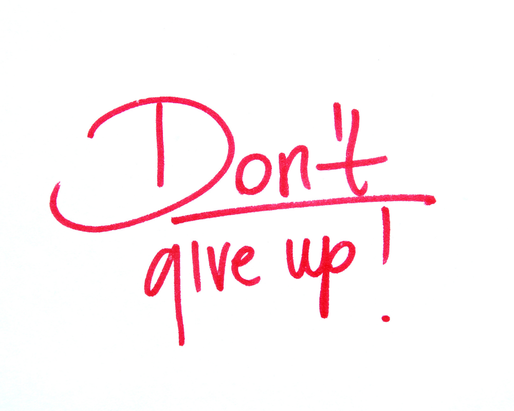 don't give up, motivational quote, red on white