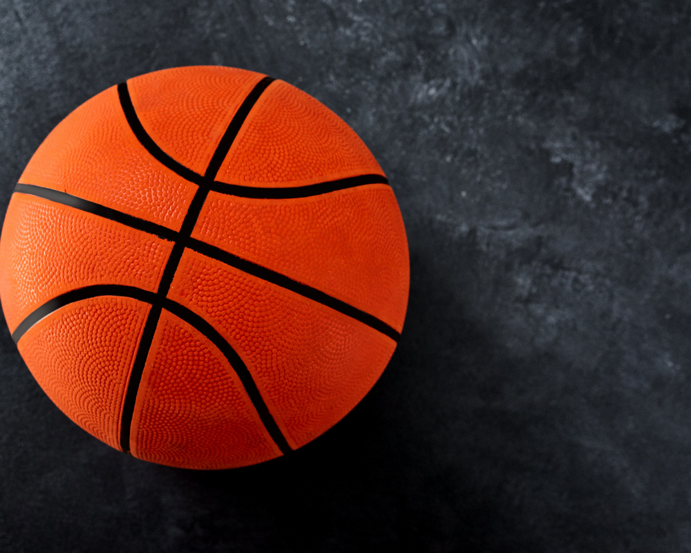 Orange basket ball on grey background.