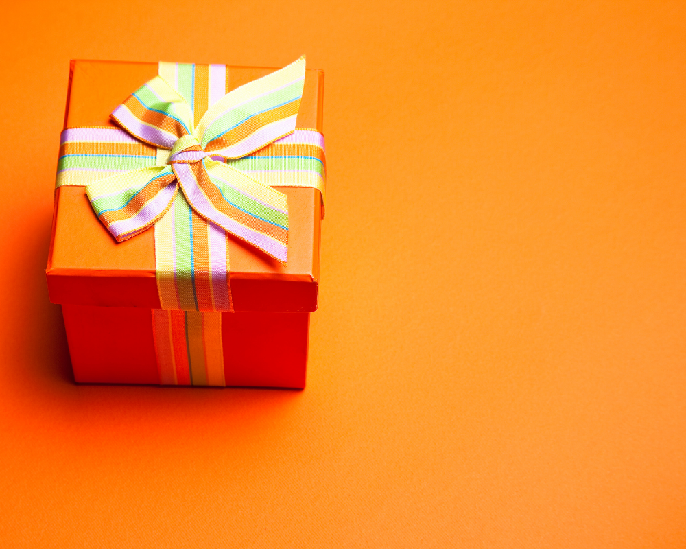Orange gift box on an orange background